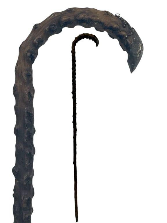 WOODEN WALKING CANE W/ KNOTTED SHAFT & METAL TIP: HAND-CARVED WOODEN WALKING CANE WITH TEXTURED KNOTTED SHAFT & METAL TIP 34" -VERY GOOD PRE OWNED CONDITION -APPROX 34" -FEATURES A DRAMATIC CURVED HANDLE WITH SCULPTED DETAILS AND METAL TIP. RUSTIC AN