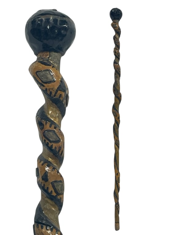 WOODEN WALKING CANE WITH BOLD SPIRAL DESIGN 36": HAND-CARVED WOODEN WALKING CANE WITH BOLD SPIRAL DESIGN 36" -VERY GOOD PRE OWNED CONDITION -APPROX 36" -FEATURES A BLACK KNOB HANDLE AND INTRICATE PAINTED PATTERNS IN EARTH TONES. TEXTURED TWISTED SHA