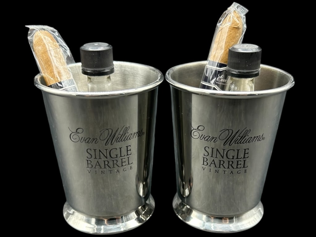 VINTAGE EVAN WILLIAMS GIFT SETS 4": - EVAN WILLIAMS SINGLE BARREL VINTAGE MINT JULEP GIFT SET – LOT OF 2A UNIQUE PROMOTIONAL PAIR OF EVAN WILLIAMS SINGLE BARREL VINTAGE STAINLESS STEEL MINT JULEP CUPS, EACH CONTAINING A MINIATURE BOTT