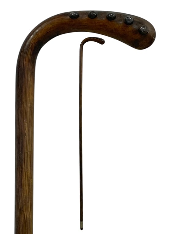 WOODEN WALKING CANE WITH STUDDED CROOK HANDLE 34": WOODEN WALKING CANE WITH STUDDED CROOK HANDLE 34" -VERY GOOD PRE OWNED CONDITION -APPROX 34" -FEATURES DECORATIVE STUDS ALONG THE TOP OF THE HANDLE FOR ADDED GRIP AND CHARACTER. SMOOTH STRAIGHT SHAFT 