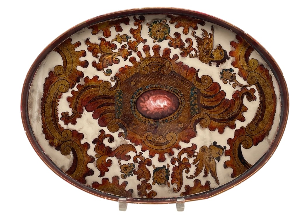 BAROQUE FLORAL TRAY 17": BAROQUE FLORAL TRAY 17" -VERY GOOD PRE OWNED CONDITION -APPROX 17" X 13" -OVAL FORM WITH ELABORATE BAROQUE FLORAL AND SCROLL MOTIFS IN RICH EARTH TONES AND RED CENTER MEDALLION. A STRIKING DECORATIVE 