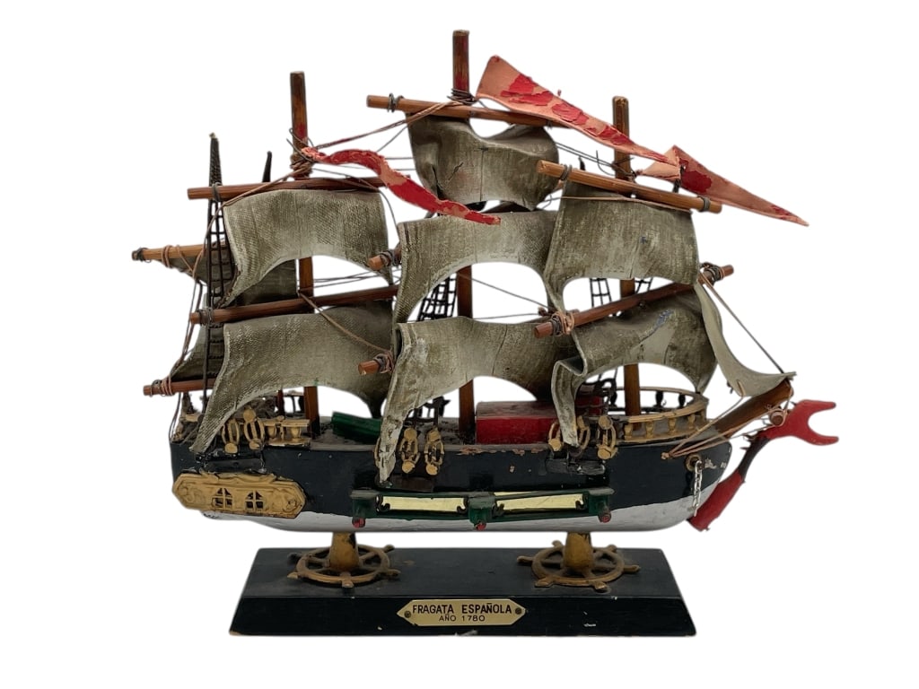 MODEL SHIP – “FRAGATA ESPANOLA ANO 1780: MODEL SHIP – “FRAGATA ESPANOLA ANO 1780” -VERY GOOD PRE OWNED CONDITION -APPROX 10" X 9" -INTRICATE HANDCRAFTED SPANISH FRIGATE WITH MULTIPLE SAILS, RIGGING, AND FLAG DETAILS, MOUNTED ON A D