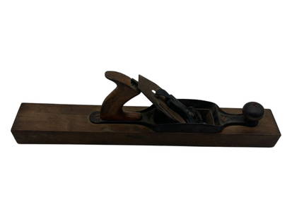 ANTIQUE WOOD AND CAST IRON HAND PLANE: - A CLASSIC WOODWORKING TOOL FEATURING A WOODEN BODY WITH A CAST IRON FRAME AND WOODEN HANDLE. SHOWS WEAR CONSISTENT WITH AGE AND USE, ADDING TO ITS RUSTIC CHARM. PERFECT FOR DISPLAY, COLLECTIONS, OR