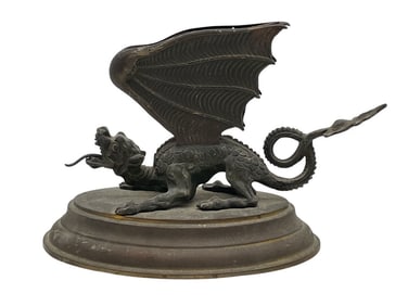 CAST METAL WINGED DRAGON FIGURINE ON ROUND BASE