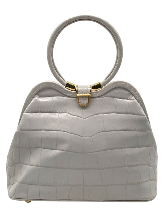 LALO WHITE LEATHER TOP HANDLE BAG: LALO WHITE LEATHER TOP HANDLE BAG -GOOD PRE OWNED CONDITION, SOME EXTERIOR MARKS (SEE PHOTOS) -APPROX 12" X 9" X 3" -FEATURES A SCULPTURAL FRAME DESIGN WITH CIRCULAR HANDLES, GOLD-TONE HARDWARE, AND S