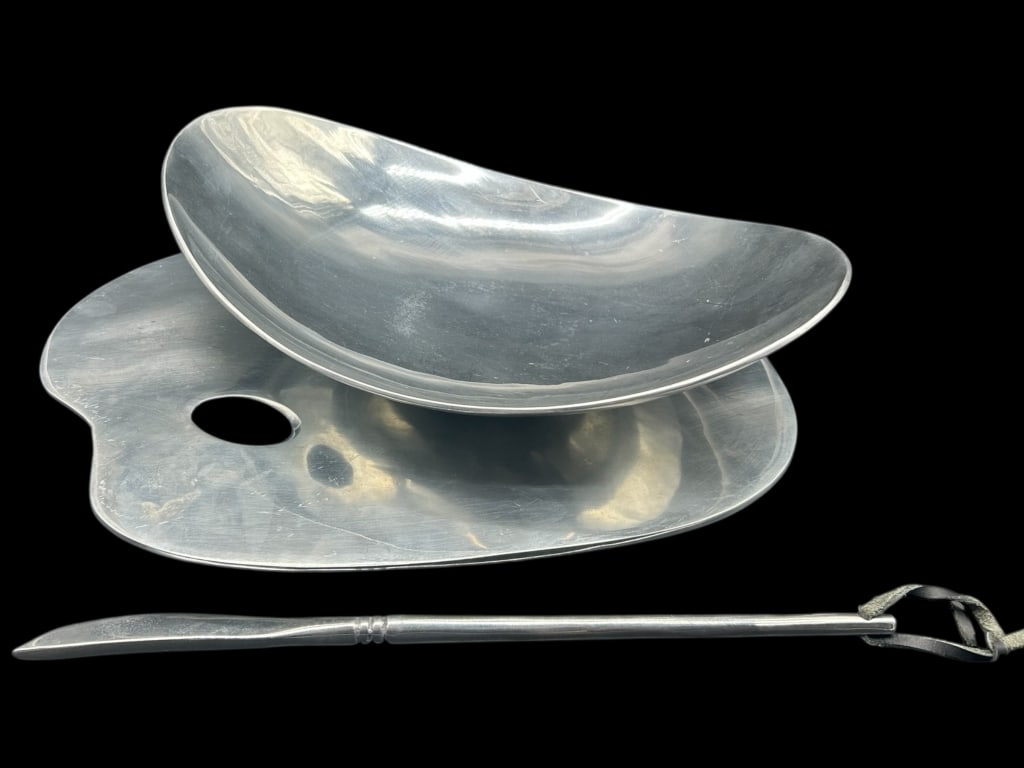 MODERN STYLE SCULPTURAL ALUMINUM SERVING SET 15": - STRIKING SET INCLUDES A BOWL, PAINTER’S PALETTE-SHAPED TRAY, AND A SPREADER/KNIFE– MINIMALIST FORMS WITH SCULPTURAL CURVES AND SATIN ALUMINUM FINISH– LIKELY INSPIRED BY DESIGNS FROM THE MID-CE