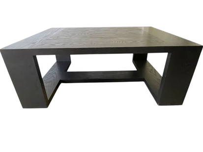 MODERN BLACK WOOD GEOMETRIC COFFEE TABLE 52": MODERN BLACK WOOD COFFEE TABLE FEATURING A STRIKING GEOMETRIC SILHOUETTE WITH CLEAN ANGLED LINES AND AN OPEN BASE DESIGN. THE TABLE IS FINISHED IN A DEEP CHARCOAL OR EBONY STAIN THAT ACCENTUATES THE N