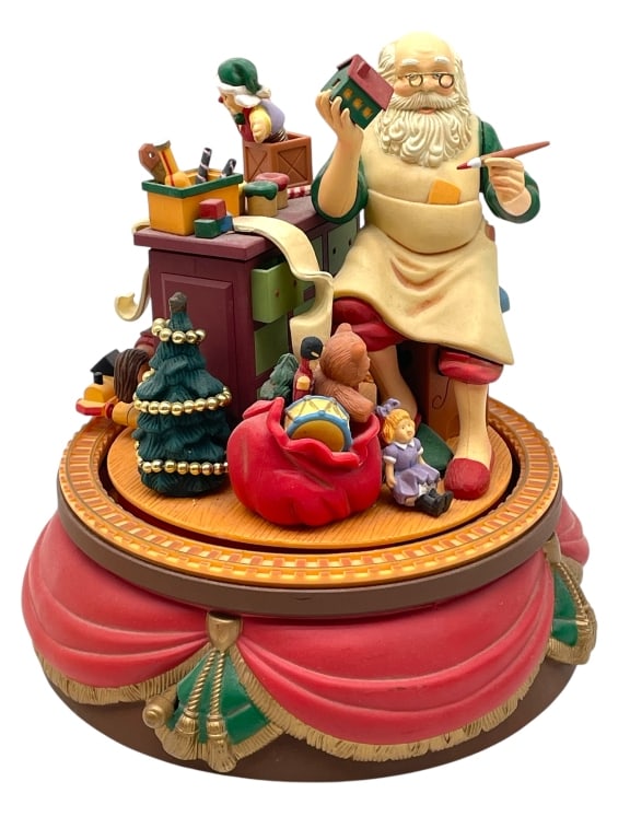 VINTAGE SANTA'S BEST ANIMATED MUSIC BOX 8": VINTAGE SANTA'S BEST ANIMATED MUSIC BOX 8" -VERY GOOD PRE OWNED CONDITION -APPROX 8" X 6" -FEATURES SANTA CLAUS PAINTING TOYS IN HIS WORKSHOP WITH A BAG OF TOYS AND MINIATURE CHRISTMAS TREE. INTRICATE