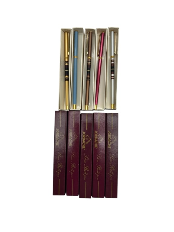 LOT OF 5 VINTAGE JORDACHE SLIM BALLPOINT PENS: - ADD A STYLISH TOUCH TO YOUR DESK OR PEN COLLECTION WITH THIS SET OF FIVE VINTAGE JORDACHE SLIM BALLPOINT PENS, EACH HOUSED IN ITS ORIGINAL MAROON PRESENTATION BOX. THE PENS COME IN A VARIETY OF VIBR