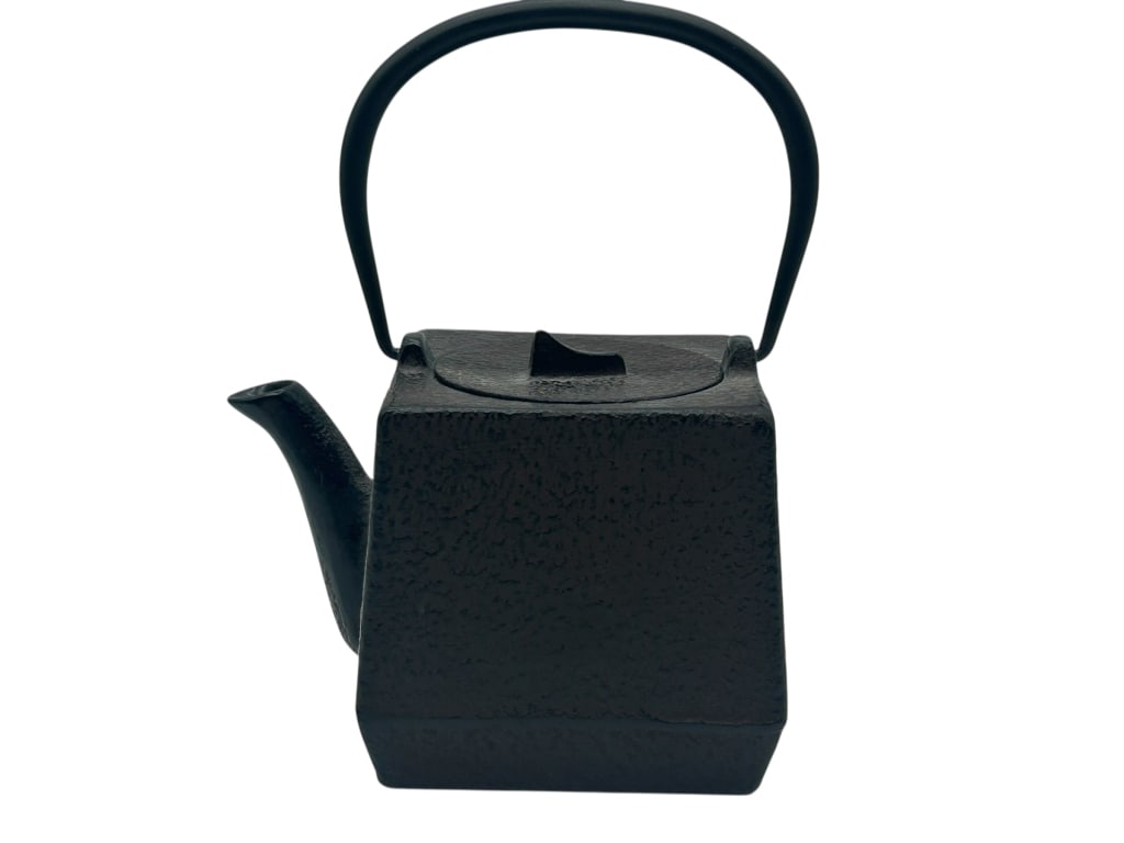 TRADITIONAL JAPANESE CAST IRON TEAPOT 4": - SLEEK AND MODERN IN A MINIMALIST BLACK FINISH, THIS TEAPOT FEATURES A GEOMETRIC SQUARE BODY WITH A TEXTURED SURFACE, CURVED SPOUT, AND GRACEFUL UPRIGHT HANDLE. EXCELLENT FOR TEA SERVICE OR AS A DECO