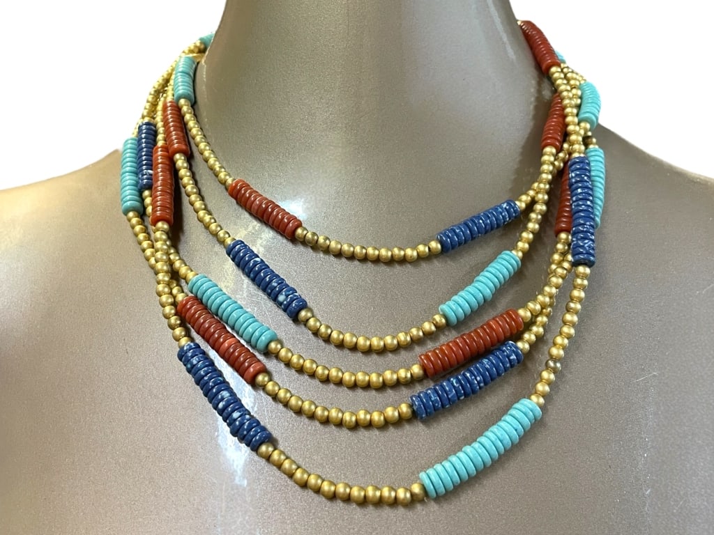CHAMEAU ET CHAMEAU MMA EGYPTIAN NECKLACE: CHAMEAU ET CHAMEAU METROPOLITAN MUSEUM OF ART EGYPTIAN NECKLACE -VERY GOOD PRE OWNED CONDITION -FEATURES LAYERS OF COLORFUL DISC BEADS IN TURQUOISE, NAVY, AND RUST TONES INTERSPERSED WITH GOLD-TONE SP