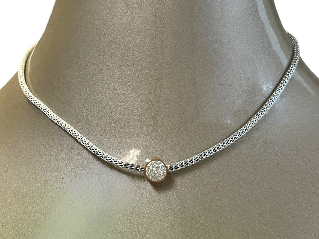 COEUR DE LEON STONE CLUSTER NECKLACE: COEUR DE LEON STONE CLUSTER NECKLACE -VERY GOOD PRE OWNED CONDITION -APPROX 6" -ELEGANT DESIGN FEATURES A TIGHTLY BRAIDED SILVER CHAIN AND A ROUND PENDANT ACCENTED WITH SPARKLING STONES IN A PAVE SETT