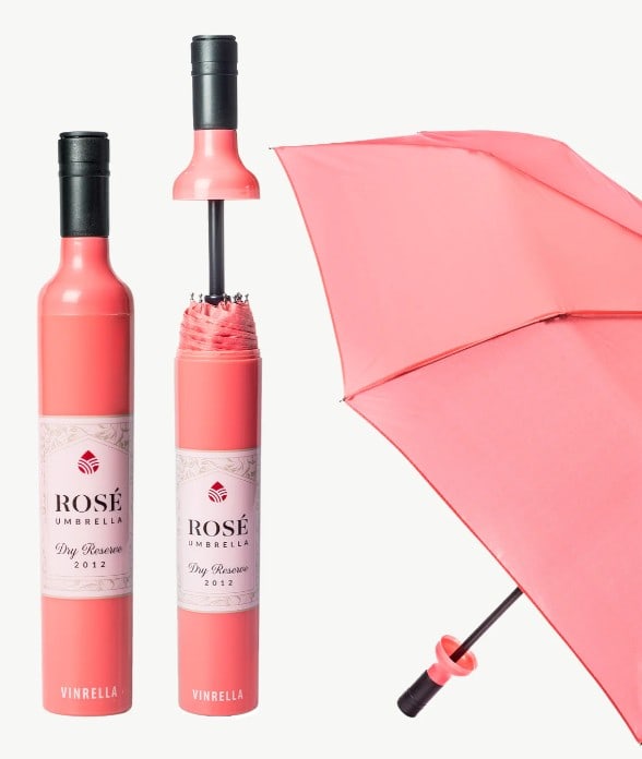 NEW! VINRELLA ROSE LABELED WINE BOTTLE UMBRELLA: NEW! VINRELLA ROSE LABELED WINE BOTTLE UMBRELLA -NEW -38” DIAMETER UMBRELLA, BOTTLE 12" X 2" -WITH A BURST OF PEACHY PINK, CARRYING THIS TO BRUNCH WILL MAKE EVERYONE THINK “I WANT WHAT SHE’S