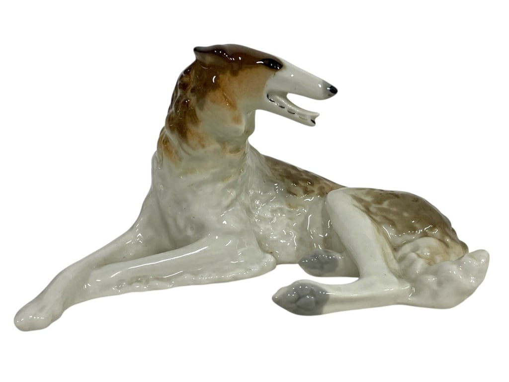 LOMONOSOV PORCELAIN GREYHOUND DOG FIGURINE 8": LOMONOSOV PORCELAIN USSR GREYHOUND DOG FIGURINE 8" -VERY GOOD PRE OWNED CONDITION -APPROX 8" X 4" -GLAZED FINISH WITH LIFELIKE DETAILING IN SHADES OF WHITE, CREAM, AND BROWN. MARKED UNDERNEATH -JA 060