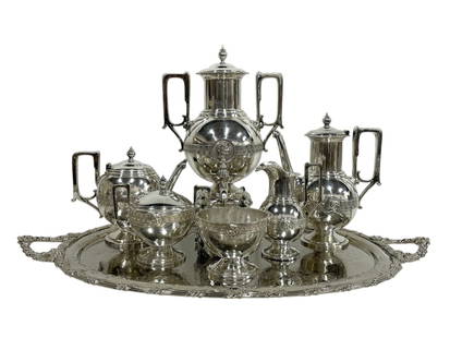 MANHATTAN PLATE CO 7 PIECE SILVER COFFEE SERVICE: MANHATTAN PLATE CO 7 PIECE SILVER TEA/COFFEE SERVICE -VERY GOOD PRE OWNED CONDITION -TRAY APPROX 31" X 19.5" (SEE PHOTOS FOR MEASUREMENTS OF OTHER PIECES) -7-PIECE TEA AND COFFEE SERVICE WITH ORNATE E