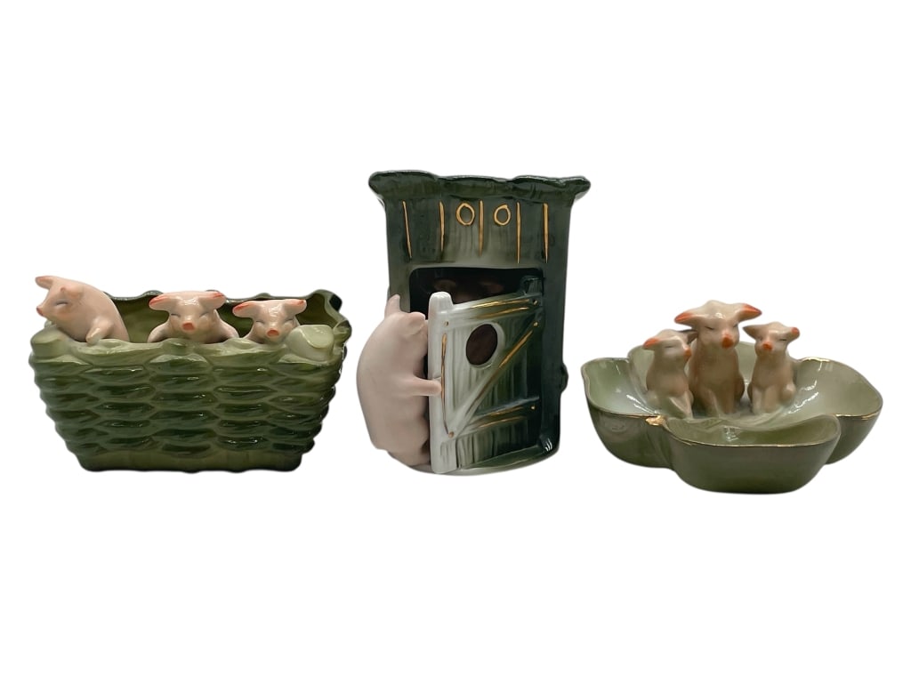 LOT OF 3 GERMAN PORCELAIN PIG FIGURINES: LOT OF 3 GERMAN PORCELAIN PIG FIGURINES -VERY GOOD PRE OWNED CONDITION -RANGE 2.5" TO 4" -FEATURES THREE PIGS RESTING IN A WICKER-STYLE BASKET, A PIG OPENING A DOOR TO AN OUTHOUSE STRUCTURE, AND THREE