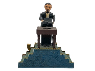 VINTAGE CAST IRON MECHANICAL "MAGICIAN BANK"