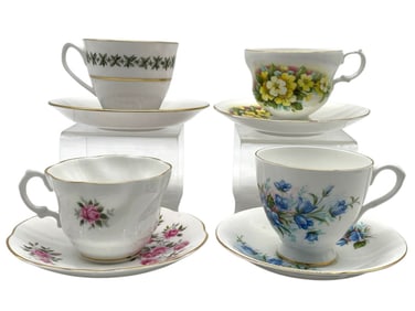 4 ASSORTED FLORAL TEACUPS AND SAUCERS