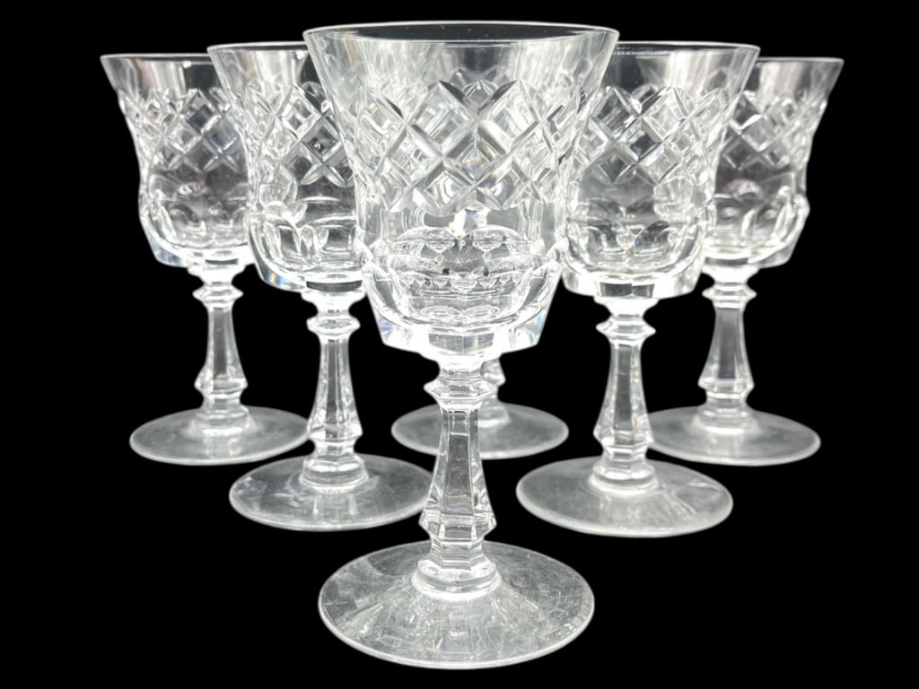 6 WATERFORD-STYLE CUT CRYSTAL WINE GOBLETS: SET OF 6 WATERFORD-STYLE CUT CRYSTAL WINE GOBLETS - GOOD PRE-OWNED CONDITION; ONE SMALL CHIP ON BASE OF ONE GLASS - SEE PHOTOS - 5.5" H, 2.75" DIAMETER APPROX - ELEGANT STEMWARE FEATURING CLASSIC CROS