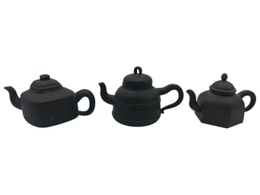 THREE MINIATURE BLACK YIXING-STYLE CLAY TEAPOTS 3"