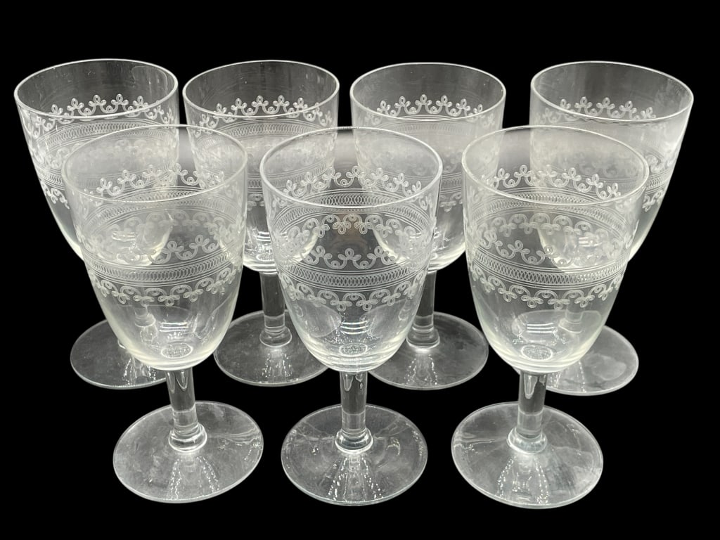 SET OF 7 ETCHED GLASSES 6.25": SET OF 7 ETCHED GLASSES 6.25" -VERY GOOD PRE OWNED CONDITION -SET OF 7 -APPROX 6.25" -ELEGANT STEMWARE WITH INTRICATE FLORAL AND SCROLLWORK BAND AROUND THE RIM. CLASSIC STYLE IDEAL FOR FORMAL DINING O