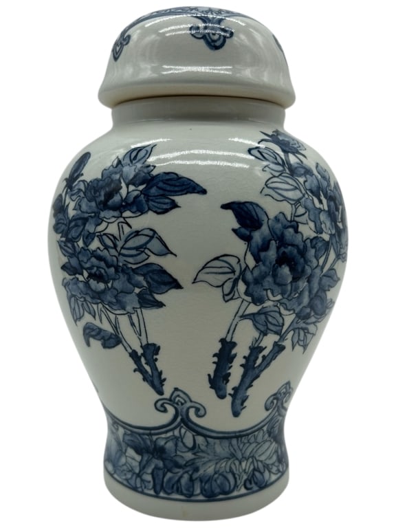 BLUE AND WHITE FLORAL GINGER JAR WITH LID 9": - BLUE AND WHITE FLORAL GINGER JAR WITH LID – A TRADITIONAL PORCELAIN VESSEL FEATURING CLASSIC CHINOISERIE STYLE DECORATION. THE BODY IS HAND-PAINTED IN COBALT BLUE WITH LUSH PEONY BLOOMS AND SCROLL
