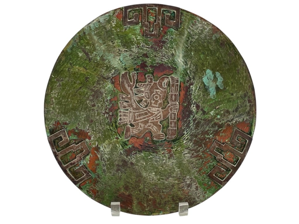 VINTAGE MEXICAN OXIDIZED COPPER WALL PLATE 12": VINTAGE MEXICAN OXIDIZED COPPER WALL PLATE 12" -VERY GOOD PRE OWNED CONDITION -APPROX 12" -FEATURES VIBRANT GREEN, RED, AND BROWN PATINA WITH ENGRAVED SYMBOLIC DESIGNS. STRIKING DECORATIVE PIECE -JA 0