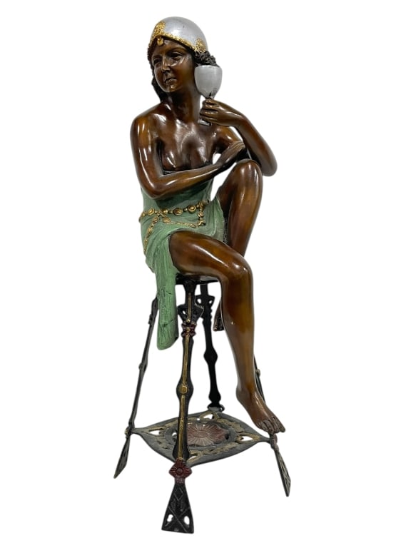 BRONZE CHAMPAGNE GIRL SCULPTURE 22": BRONZE CHAMPAGNE GIRL SCULPTURE 22" -VERY GOOD PRE OWNED CONDITION -APPROX 22" X 7" -FEATURES A PARTIALLY NUDE WOMAN WITH DETAILED GREEN SKIRT, SILVER HEADDRESS, AND JEWELED BELT, HOLDING A GOBLET AND