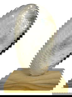 LARGE POLISHED SHELL SCULPTURE ON WOOD STAND: LARGE POLISHED SHELL SCULPTURE ON WOOD STAND -SHOWROOM CONDITION -APPROX 10" X 7.5" X 4.5" -STANDING APPROXIMATELY 10 INCHES TALL, THIS STRIKING NATURAL SHELL FEATURES A HIGH-GLOSS, IRIDESCENT FINISH