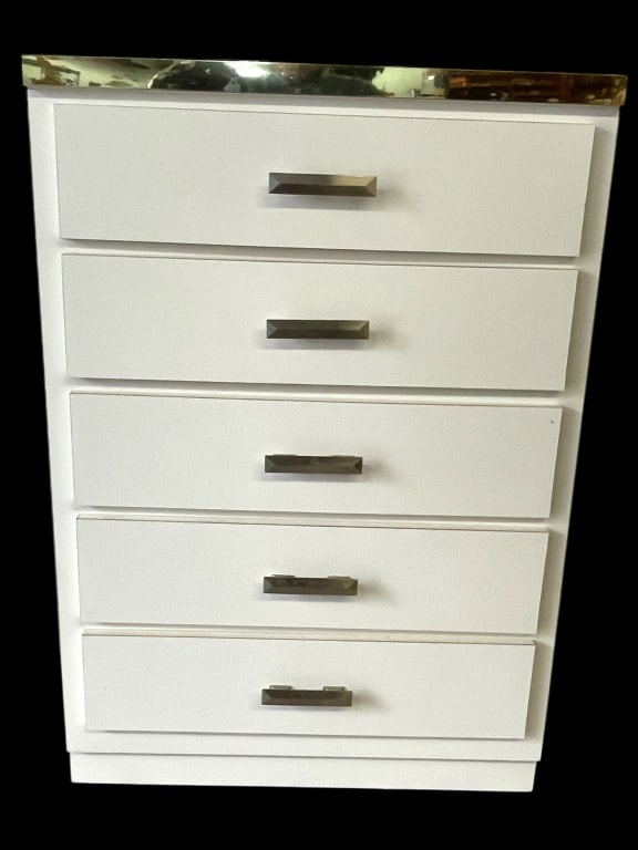 FIVE-DRAWER WHITE & CHROME CHEST/ DRESSER: FIVE-DRAWER WHITE CHEST OF DRAWERS WITH CHROME TRIM – A SLEEK AND CONTEMPORARY PIECE WITH A HIGH-GLOSS WHITE FINISH, CHROME TRIM DETAILING, AND MODERN FACETED HANDLES. MEASURES APPROXIMATELY 45" X 3