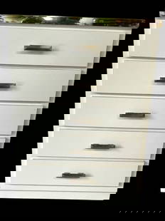 FIVE-DRAWER WHITE & CHROME CHEST/ DRESSER: FIVE-DRAWER WHITE CHEST OF DRAWERS WITH CHROME TRIM – A SLEEK AND CONTEMPORARY PIECE WITH A HIGH-GLOSS WHITE FINISH, CHROME TRIM DETAILING, AND MODERN FACETED HANDLES. MEASURES APPROXIMATELY 45" X 3