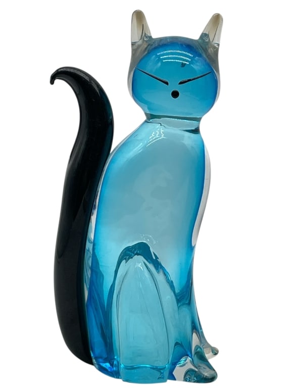 MURANO FORMIA ART GLASS CAT SCULPTURE: MURANO FORMIA ART GLASS CAT SCULPTURE -VERY GOOD PRE OWNED CONDITION -APPROX 9.5" X 4" X 2.5" -WHIMSICAL BLOWN ART GLASS CAT SCULPTURE IN VIBRANT TRANSLUCENT BLUE WITH A GLOSSY BLACK TAIL AND FACIAL F