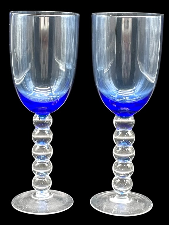 PAIR OF HAND-BLOWN ART GLASS GOBLETS: PAIR OF HAND-BLOWN ART GLASS GOBLETS -VERY GOOD PRE OWNED CONDITION -APPROX 8.5" X 2.5" -STRIKING PAIR OF HAND-BLOWN ART GLASS GOBLETS FEATURING CLEAR BOWLS THAT TRANSITION INTO RICH COBALT BLUE AT TH