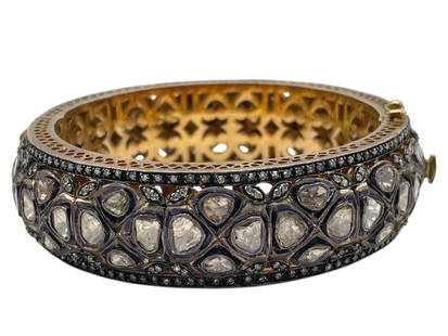 DIAMOND GOLD & SILVER BANGLE BRACELET: DIAMOND GOLD & SILVER BANGLE BRACELET -VERY GOOD PRE OWNED CONDITION -ELECTRONICALLY TESTED SILVER AND GOLD LADIES CUSTOM CAST & HAND CRAFTED DIAMOND BANGLE BRACELET. NUMEROUS ILLUSION SET ROSE CUT DI