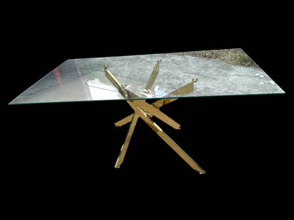MID MOD STYLE GLASS & BRASS DINING TABLE 63": MID-CENTURY MODERN STYLE GLASS & BRASS DINING TABLE -DESCRIPTION: EYE-CATCHING MID-CENTURY MODERN STYLE DINING OR CENTER TABLE FEATURING A SLEEK RECTANGULAR GLASS TOP SUPPORTED BY A SCULPTURAL BRASS T