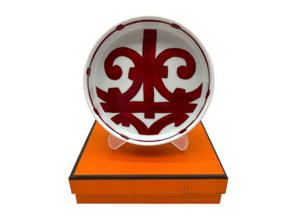 HERMES PORCELAIN BALCON DU GUADALQUIVIR SMALL DISH: HERMES PORCELAIN BALCON DU GUADALQUIVIR SMALL DISH -NEW IN BOX -APPROX 6" -HERMÈS PORCELAIN "BALCON DU GUADALQUIVIR" SMALL DISH N°3, FEATURING A BOLD RED SCROLLWORK DESIGN INSPIRED BY THE WROUGHT IR