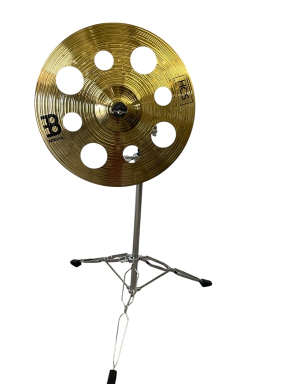 MEINL HCS TRASH CRASH CYMBAL WITH STAND 16": MEINL HCS TRASH CRASH CYMBAL WITH STAND - THIS IS A MEINL HCS TRASH CRASH CYMBAL MEASURING 16" IN DIAMETER, MOUNTED ON A HEAVY-DUTY ADJUSTABLE CHROME STAND. IT FEATURES DISTINCTIVE CUTOUT HOLES TO CRE