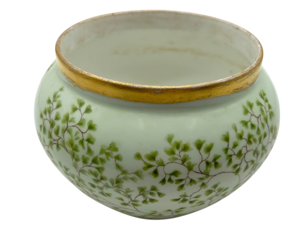 D&C FRANCE PORCELAIN VASE: D&C FRANCE PORCELAIN VASE -VERY GOOD PRE-OWNED CONDITION -APPROX 6" -ELEGANT BOULE SHAPE WITH DELICATE HAND-PAINTED GREEN FOLIAGE AND SUBTLE GILT RIM, SIGNED “D&C FRANCE.” ITS SOFT PASTEL GLAZ