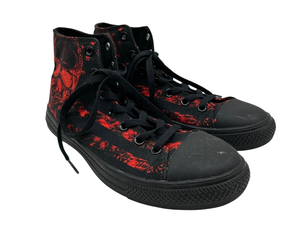 RAAD BLACK AND RED SKULL HIGHTOP SNEAKERS SZ 8.5M: RAAD HIGH-TOP SNEAKERS FEATURING A BOLD RED AND BLACK SKULL DESIGN WITH BLACK RUBBER TOE CAPS, SOLES, AND METAL EYELETS. THIS STRIKING PAIR SHOWCASES RAAD’S SIGNATURE ALTERNATIVE STYLE, COMBINING ST