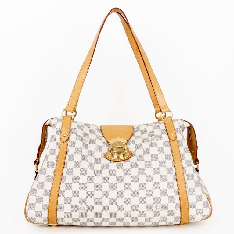 LOUIS VUITTON STRESA GM IVORY DAMIER AZUR BAG: The Louis Vuitton Stresa GM is a refined and spacious tote that blends elegance with practicality. Crafted in France from the iconic Damier Azur coated canvas, it is complemented by natural Vachetta l