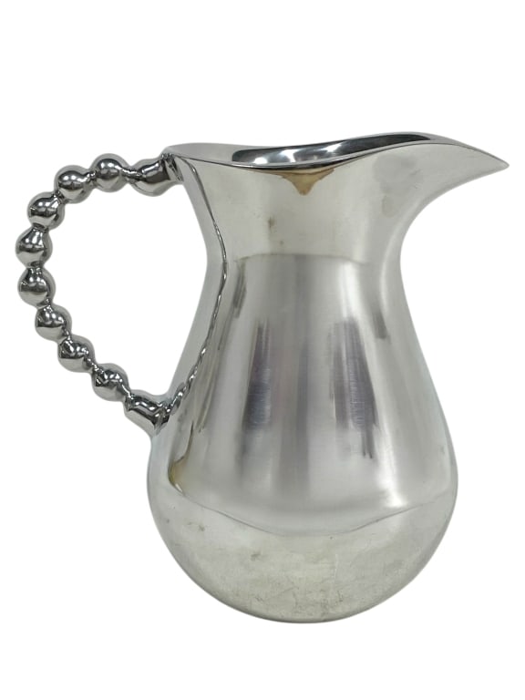 BILTMORE BIG BEAD SILVER PITCHER 9": BILTMORE BIG BEAD SILVER PITCHER 9" -VERY GOOD PRE OWNED CONDITION -APPROX 9" X 6" X 9" -THIS STRIKING PITCHER FEATURES A POLISHED BODY WITH A SCULPTURAL BEADED HANDLE DESIGN, GIVING IT A CONTEMPORARY
