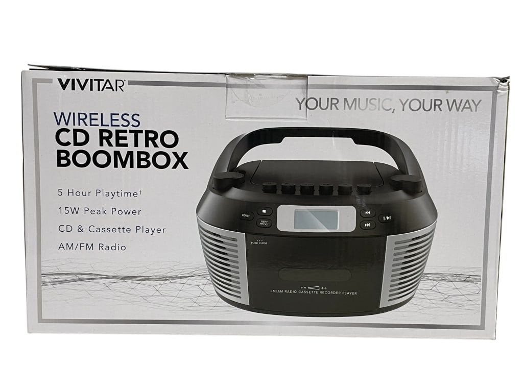 VIVITAR WIRELESS CD RETRO BOOMBOX IN BOX: VIVITAR WIRELESS CD RETRO BOOMBOX IN BOX -GOOD PRE OWNED CONDITION, UNTESTED -ENJOY YOUR MUSIC YOUR WAY WITH THIS VERSATILE BOOMBOX FEATURING 5 HOUR PLAYTIME, 15W PEAK POWER, CD AND CASSETTE PLAYER, A