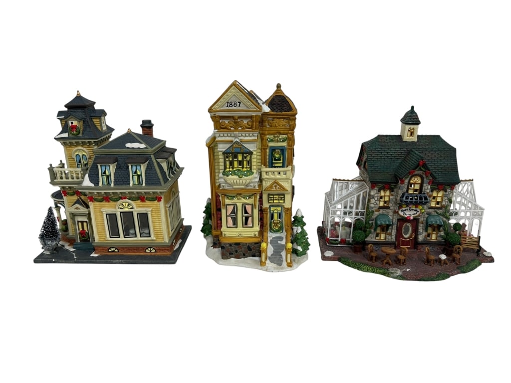 LOT OF 3 CHRISTMAS VILLAGE PORCELAIN BUILDINGS: THIS IS A CHARMING COLLECTION OF THREE PORCELAIN CHRISTMAS VILLAGE HOUSES, IDEAL FOR ENHANCING YOUR HOLIDAY DECOR OR ADDING TO A COLLECTIBLE VILLAGE DISPLAY. THE SET INCLUDES A SANTA'S WORKBENCH VICTO