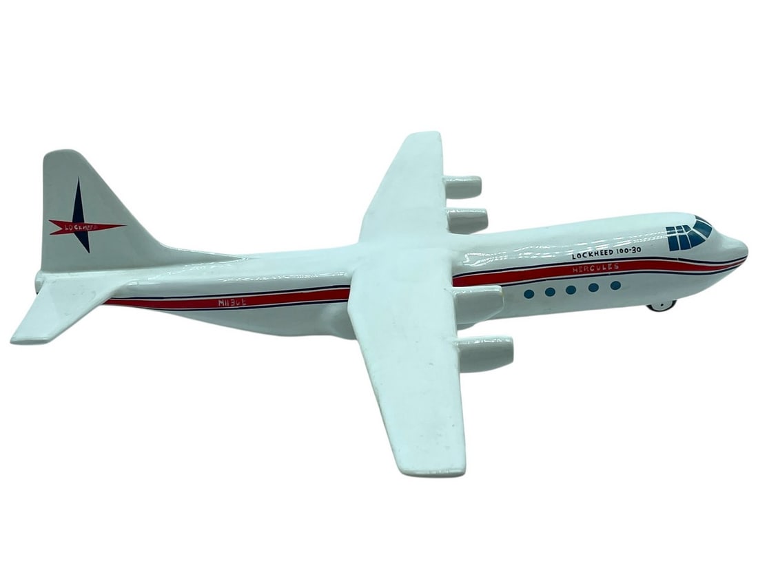 LOCKHEED L-100-30 HERCULES CERAMIC DECANTER 18": VINTAGE LOCKHEED L-100-30 HERCULES CERAMIC DECANTER – A RARE AND WHIMSICAL CERAMIC LIQUOR DECANTER SHAPED LIKE A LOCKHEED L-100-30 HERCULES CARGO PLANE, FEATURING AUTHENTIC DETAILS INCLUDING THE "LO