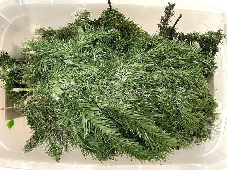 BIN OF MIXED ARTIFICIAL PINE BRANCHES: BIN OF MIXED ARTIFICIAL PINE BRANCHES -GOOD PRE OWNED CONDITION, SEE PHOTOS -A GENEROUS COLLECTION OF LIFELIKE EVERGREEN PICKS, GARLAND SECTIONS, AND BRANCHES PERFECT FOR HOLIDAY DECOR, WREATH MAKING,