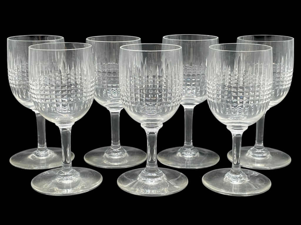 7 BACCARAT NANCY WINE GLASSES 5": 7 BACCARAT NANCY WINE GLASSES -VERY GOOD PRE OWNED CONDITION -7 GLASSES -APPROX 5" X 2" -FEATURING AN ELEGANT VERTICAL AND CROSSHATCH PATTERN THAT REFLECTS LIGHT BEAUTIFULLY. CLASSIC STEM FORM, PERFEC
