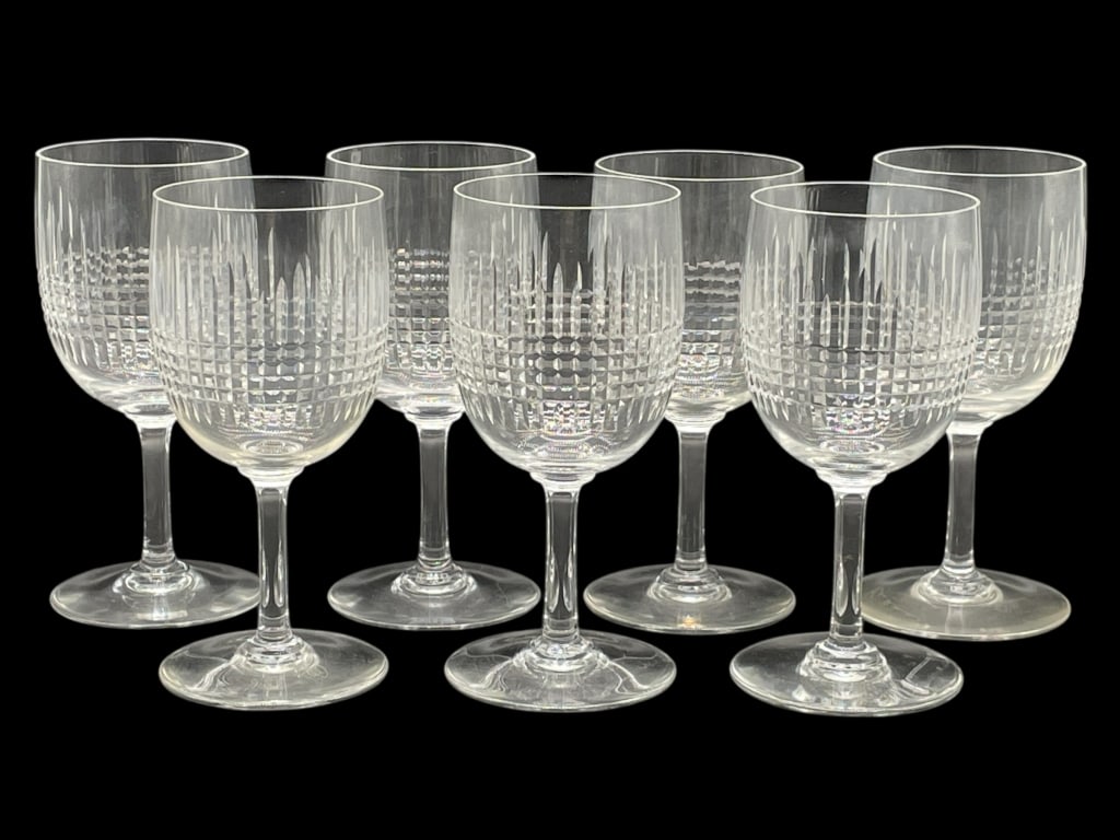 7 BACCARAT NANCY CRYSTAL WINE GLASSES 6": 7 BACCARAT NANCY CRYSTAL WINE GLASSES 6" -VERY GOOD PRE OWNED CONDITION -7 GLASSES -APPROX 6" X 2.5" -FEATURING A GEOMETRIC CROSSHATCH AND VERTICAL LINE PATTERN THAT CATCHES THE LIGHT BEAUTIFULLY. ELE