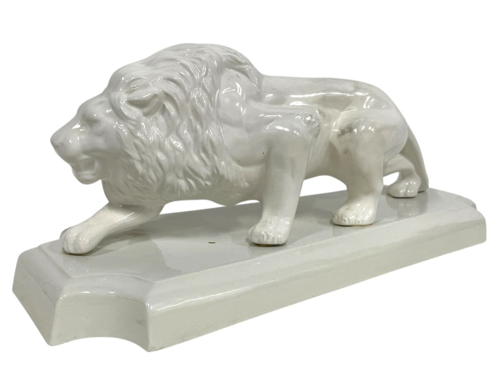 CERAMIC LION FIGURINE ON RECTANGULAR BASE 17": CERAMIC LION FIGURINE ON RECTANGULAR BASE 17" -GOOD PRE OWNED CONDITION, SOME REPAIRS (SEE PHOTOS) -APPROX 17"L X 7"W X 7.5"H -FEATURES A DETAILED SCULPTURE OF A STRIDING LION WITH MANE AND FACIAL FEA