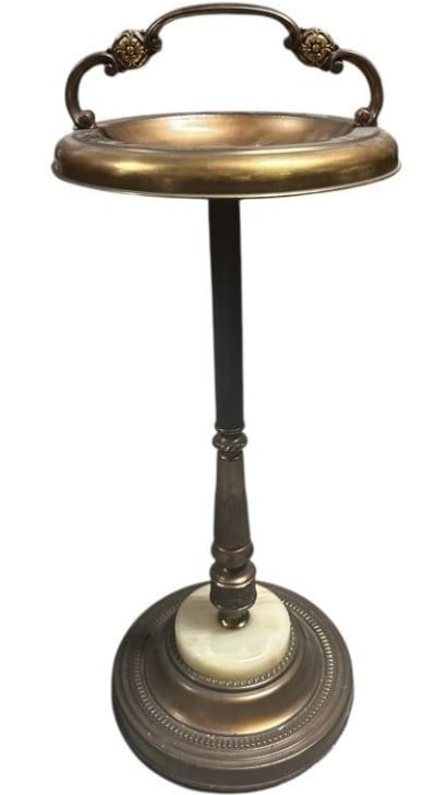 BRASS AND MARBLE SMOKER’S STAND 28": "- ELEGANTLY CRAFTED VINTAGE SMOKER’S STAND FEATURING A POLISHED BRASS TRAY WITH DECORATIVE HANDLE, SUPPORTED BY A TURNED COLUMN WITH CLASSIC FLUTING. BASE IS ACCENTED WITH A RICHLY VEINED ROUND ONY