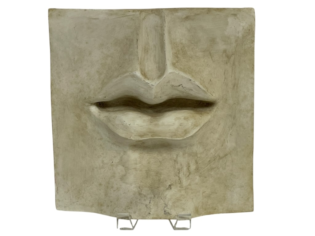 TMS 2002 SCULPTURE OF LIPS WALL HANGING 10": TMS 2002 SCULPTURE OF LIPS WALL HANGING 10"_x005F -VERY GOOD PRE OWNED CONDITION_x005F -APPROX 10"H X 9.5"W_x005F -DISPLAYING A STRONG GEOMETRIC FORM WITH NATURALISTIC DETAIL._x005F -JA 091625_x005F _